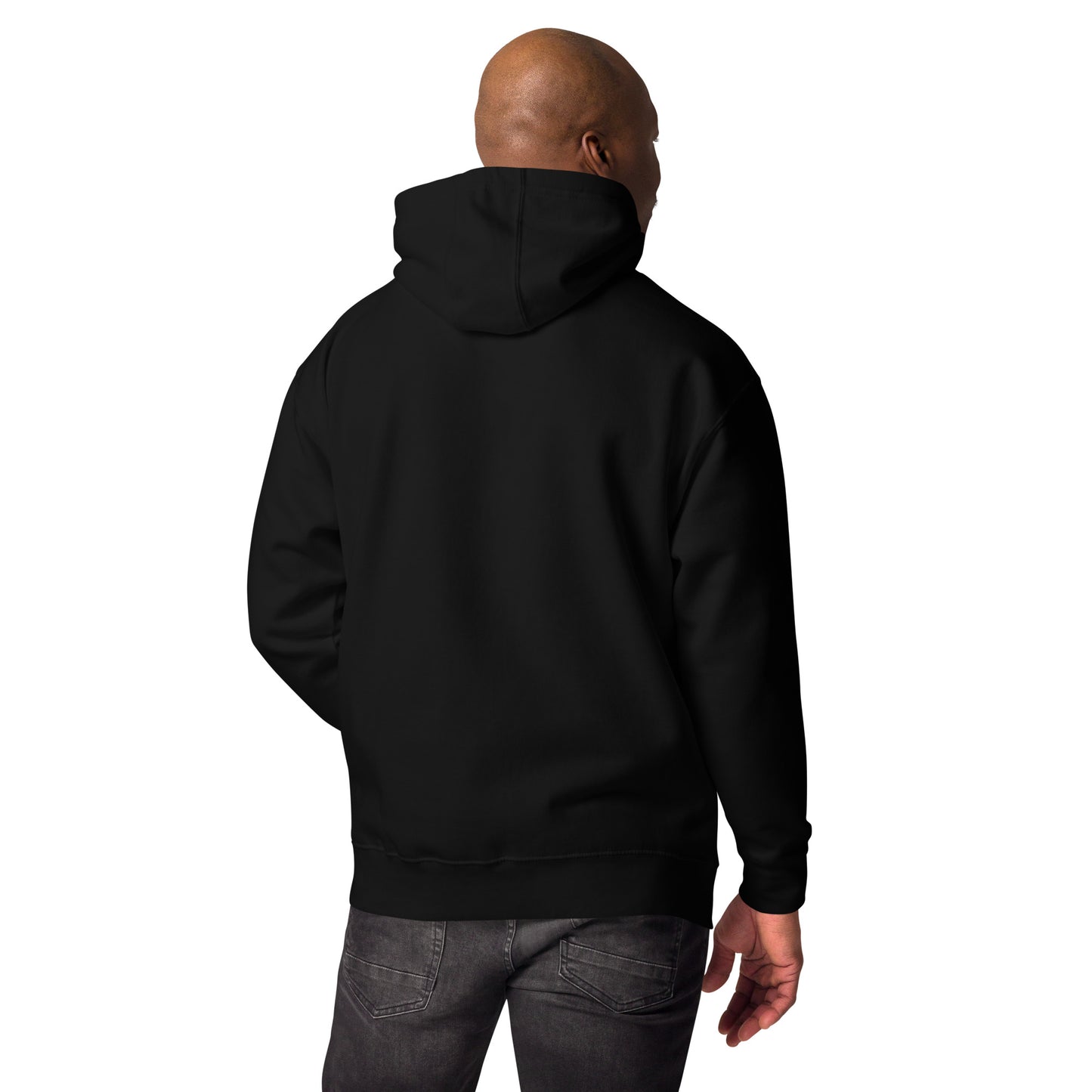 A black male model standing, showing backview of pullover hoodie with a stylish red graphic of a stylized skull wearing a fedora hat and a mustache. Purple cross symbols are scattered around the skull, and the text 'NIBO' is written below it. The design is a spiritual nod to Haitian Gede culture.