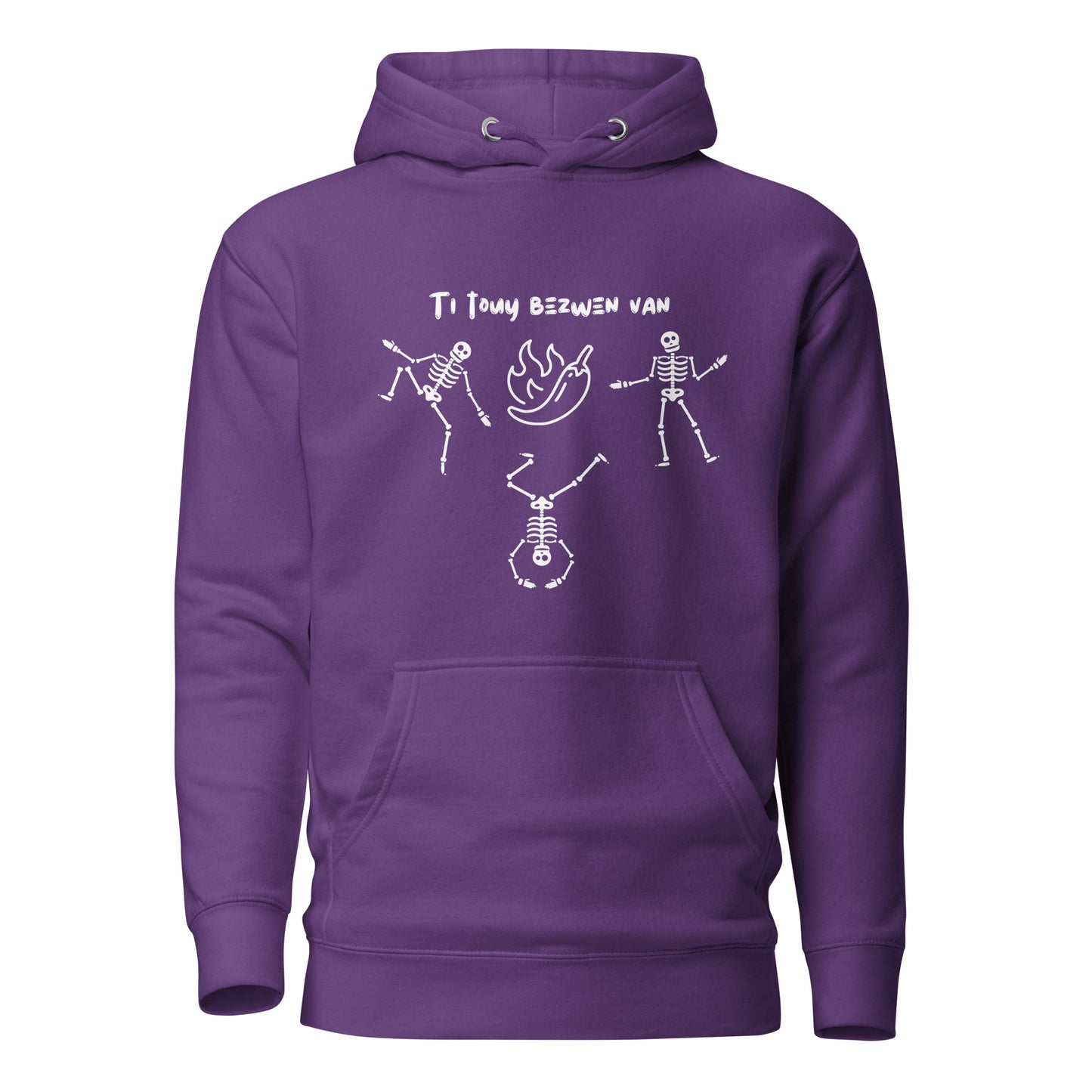 A purple pullover hoodie with a white line-art graphic of three dancing skeletons. The middle skeleton is doing a handstand. Above them is a hot pepper with flames, and the text 'TI TOUY BEZWEN NAN'. The design is a playful nod to a Haitian cultural tradition.