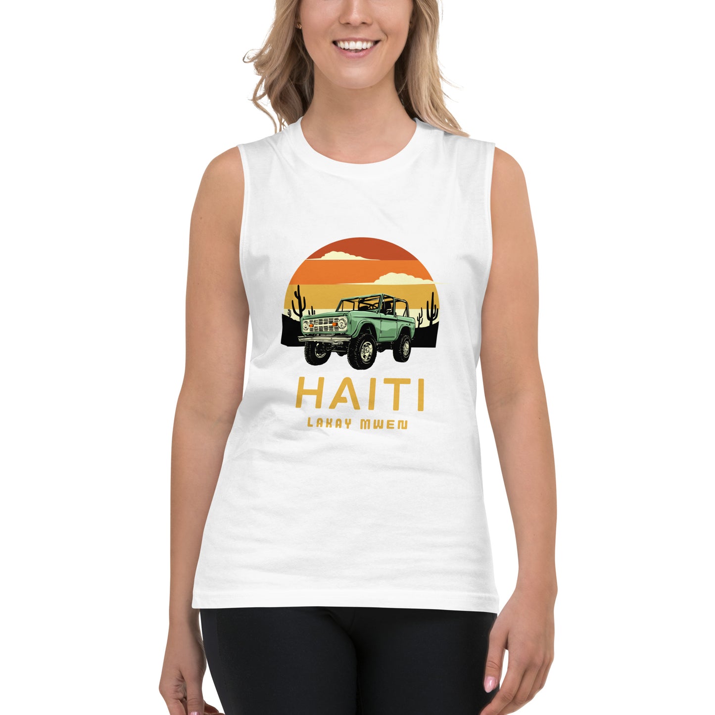 Smiling white female model wearing a white Bella+Canvas 'HAITI LAKAY MWEN' unisex muscle tank top (front view) featuring a retro sunset and green vintage Jeep graphic.