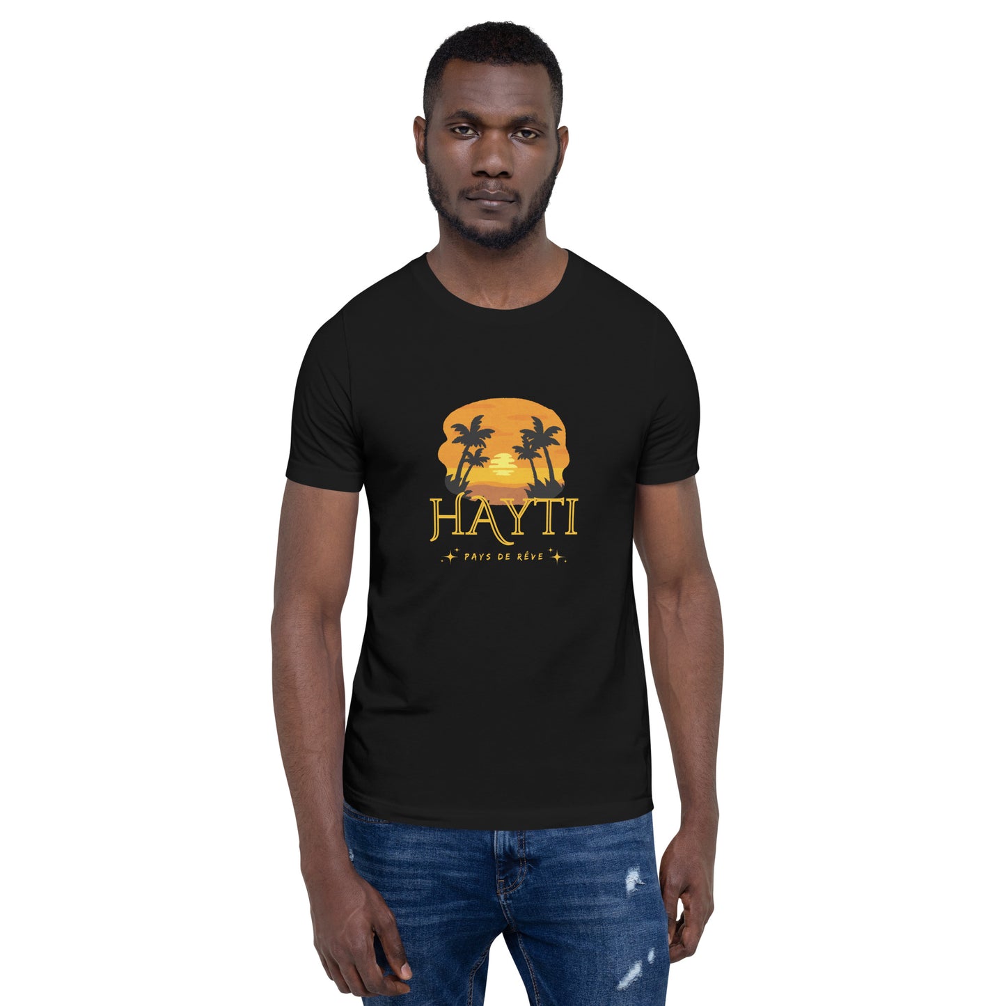 Black man wearing a black Bella+Canvas 'HAYTI PAYS DE RÊVE' unisex T-shirt (front view) featuring a golden hour sunset graphic with palm trees and twinkling stars. White background.
