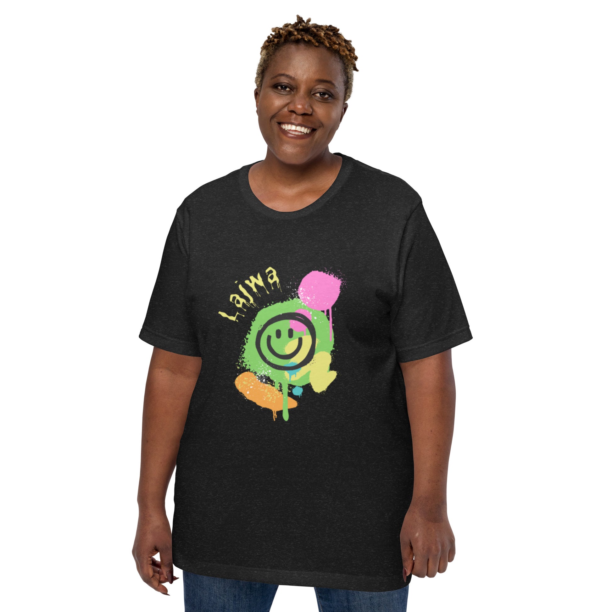 Smiling black female model wearing a black XL Bella+Canvas 'Lajwa' unisex T-shirt (front view) with a colorful dripping paint smiley face graphic in bright pink, green, orange, and yellow.
