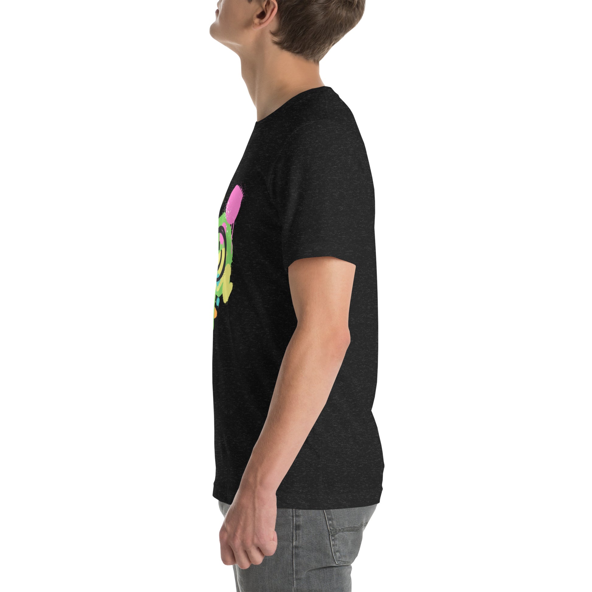 White male model wearing a black Bella+Canvas 'Lajwa' unisex T-shirt (left side view) with a colorful dripping paint smiley face graphic in bright pink, green, orange, and yellow.
