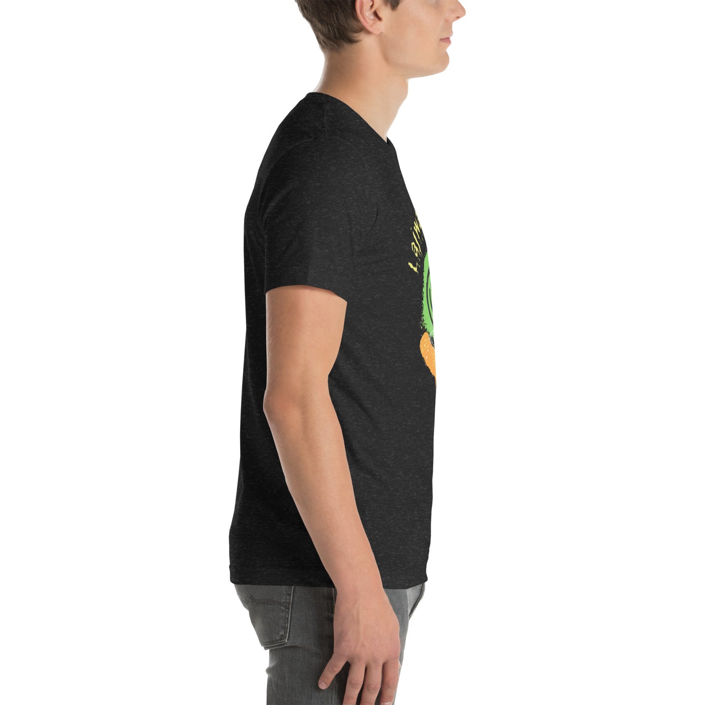 White male model wearing a black Bella+Canvas 'Lajwa' unisex T-shirt (right side view) with a colorful dripping paint smiley face graphic in bright pink, green, orange, and yellow.