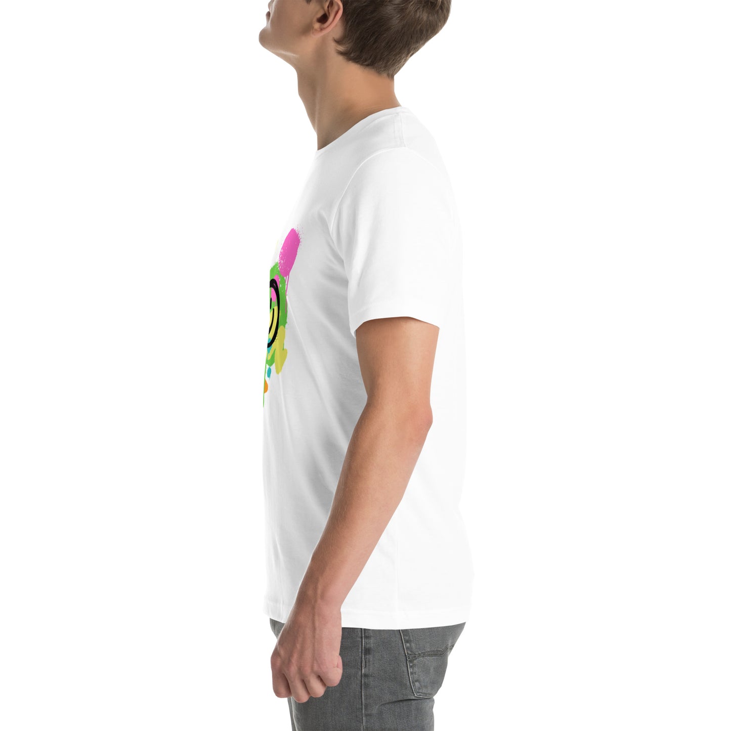White male model wearing a Bella+Canvas 'Lajwa' unisex T-shirt (left side view) with a colorful dripping paint smiley face graphic in bright pink, green, orange, and yellow.