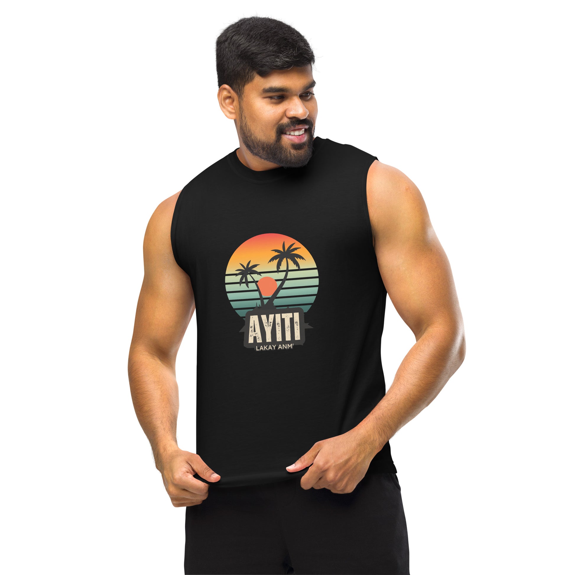 Male model wearing a Black Bella+Canvas 'AYITI LAKAY ANM'' unisex muscle tank top (front view) with a vibrant orange and blue sunset graphic featuring two palm trees silhouetted.