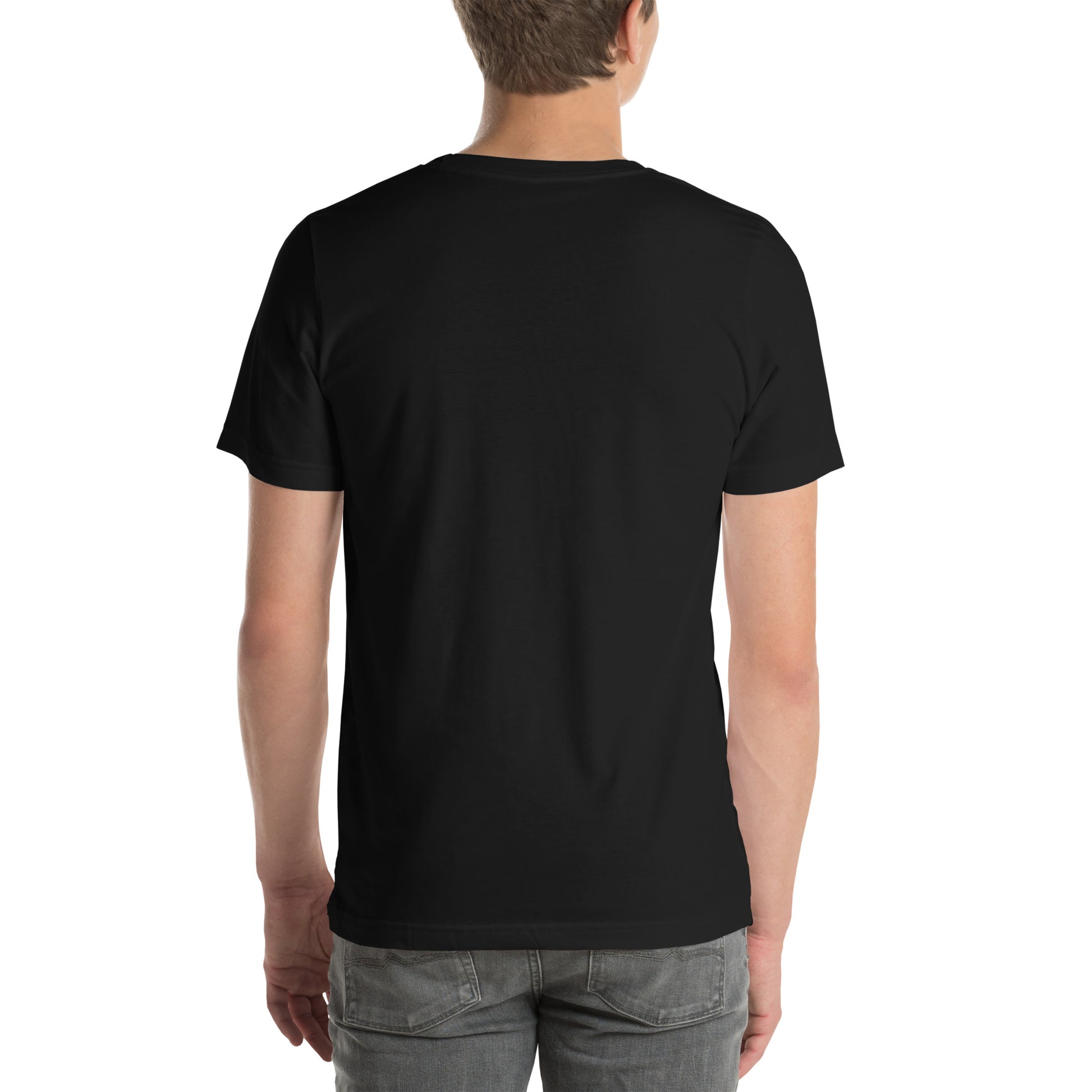 White Male model wearing a black Bella+Canvas 'LAVI S'ON BÈL RANS' unisex T-shirt (back view) featuring cream text and a realistic white floral graphic. 