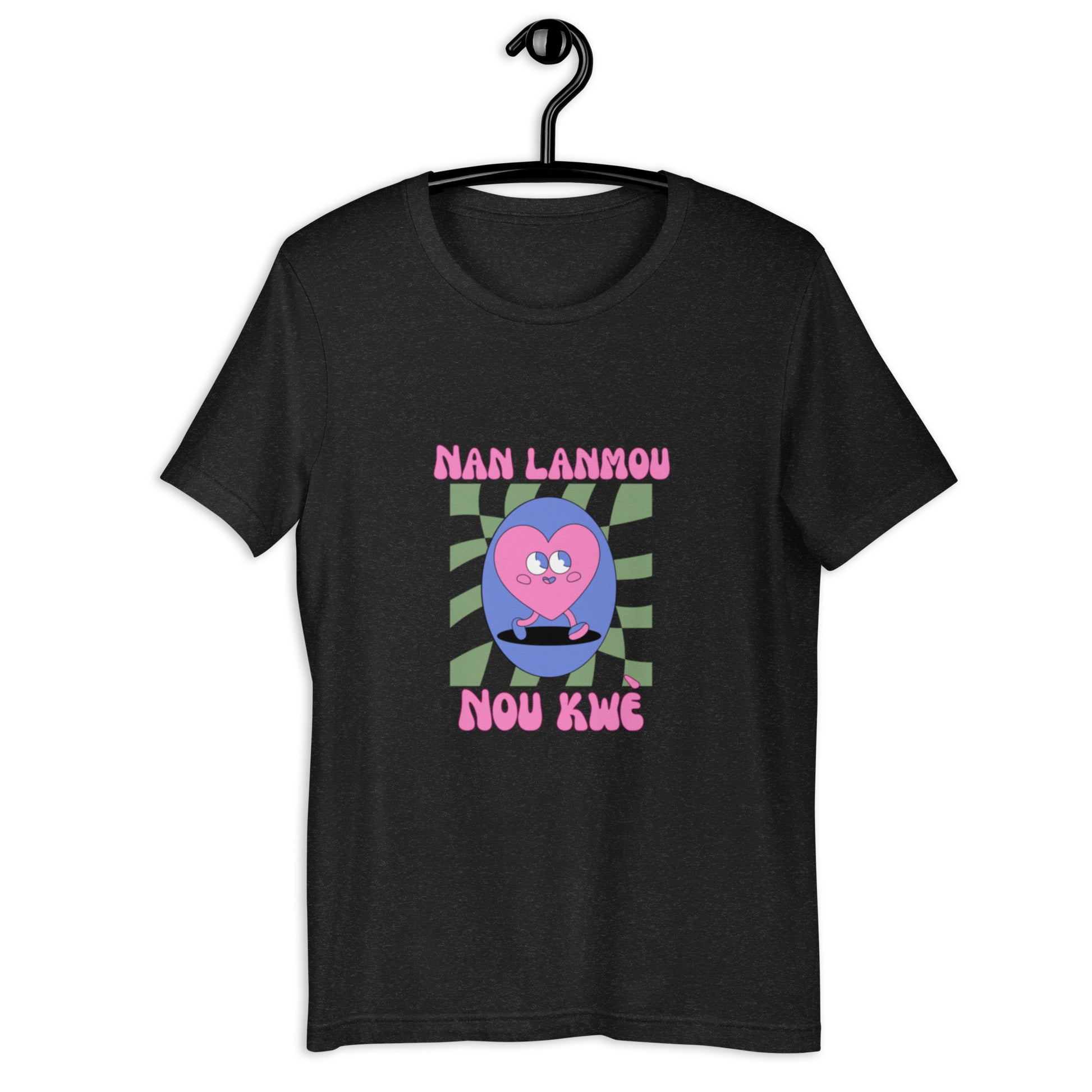 Black Bella+Canvas 'Nan Lanmou Nou Kwe' unisex T-shirt (front view) featuring a pink and blue abstract heart graphic with a smiley face and paint drip accents.